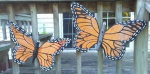 lot 107 image: Wood Monarch butterflies.