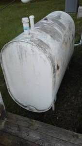 lot 124 image: 500-gallon oil barrel.