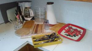 lot 132 image: Bread knife, flatware, cutting boards and more.