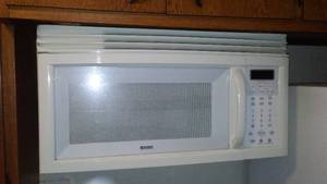 lot 149 image: Microwave over stove. Kenmore - working.