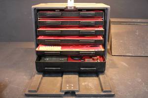 lot 65 image: Small Arms Toolkit to include Yost table vise, screwdrivers, brushes, pliers, files, wrenches, hex heads and more