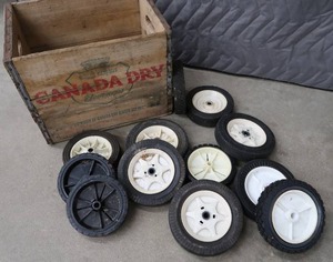 VINTAGE CANADA DRY WOODEN BOX FULL OF OLD WHEELS.
