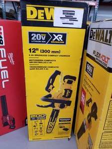 lot 409 image: DeWalt 20V Cordless XR Brushless Lithium Ion 12 5 Ah Compact Chainsaw (in box)  with Battery and Charger
