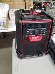 lot 413 image: Milwaukee Radio  M18 Charger  with Milwaukee M18 Red Lithium Battery