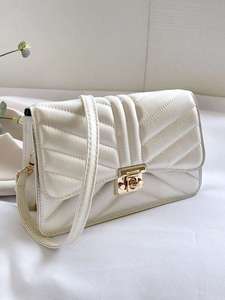 lot 30 image: Textured Twist Lock Crossbody Bag