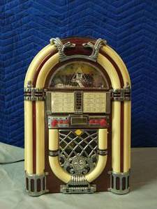 lot 100 image: Mini Juke-Box CD Player AMFM Radio