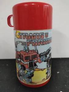 lot 78 image: Vintage 1984 Transformers Thermos