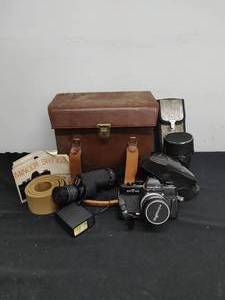 lot 16 image: Vintage Minolta Camera with Accessories