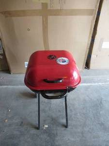 lot 36 image: Americana Walk-A-Bout Portable Charcoal Grill