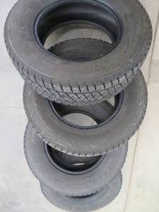 4 BLIZZAK TIRES WITH EXCELLENT TREAD