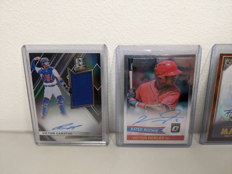 lot 15 image: Collection of 4 Autographed Baseball Cards Victor Caratini, Victor Robles, Trey Mancini & Andres Gimenez