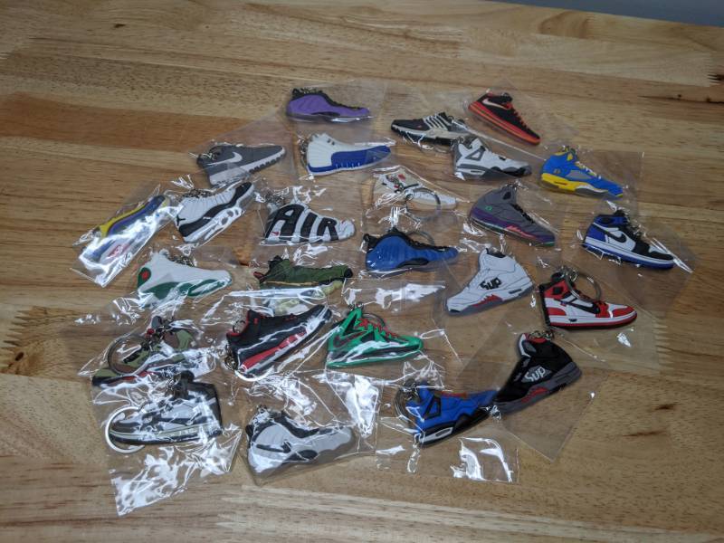 lot 51 image: Collection of 25 Brand New Nike and Jordan Shoe Sneaker Keychains Retro Air Foamposite