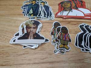lot 93 image: Mix of Hip Hop & Rap Music Stickers Post Malone Biggie Tupac Nipsey Hustle Miller Rihanna Miley Cardi B