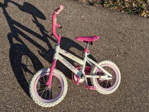 lot 603 image: Pink and White Huffy Seastar Bike