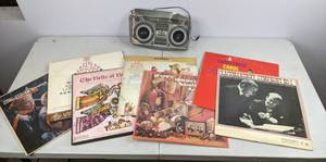 lot 519 image: Assortment of (7) Classical and Christmas Records and Cardboard Boombox