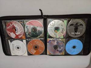 lot 608 image: Case Logic full of Country CDs - Tim McGraw, Brooks & Dunn, Shania Twain, Toby Keith, Rascal Flatts, Willie Nelson, and more