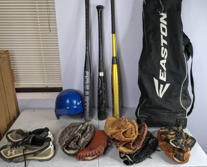 lot 670 image: BaseballSoftball Lot Easton Bats and Bag, Gloves, Under Armour Cleats, and Helmet