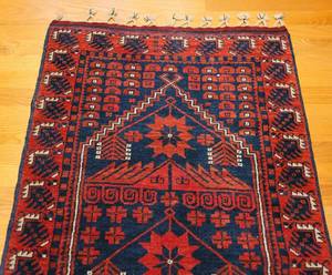 lot 162 image: Poinsettia Patterned Red & Blue Rug