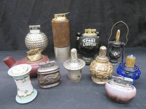 lot 67 image: UNIQUE COLLECTION OF VINTAGE LIGHTERS PLUS RISQUE BOX OF MATCHES