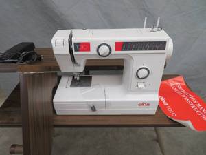 lot 88 image: SEWING MACHINE WITH SEWING MACHINE TABLE.