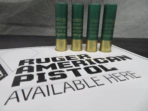 lot 105 image: RUGER AMERICAN PISTOL METAL SIGN  PLUS AMMO