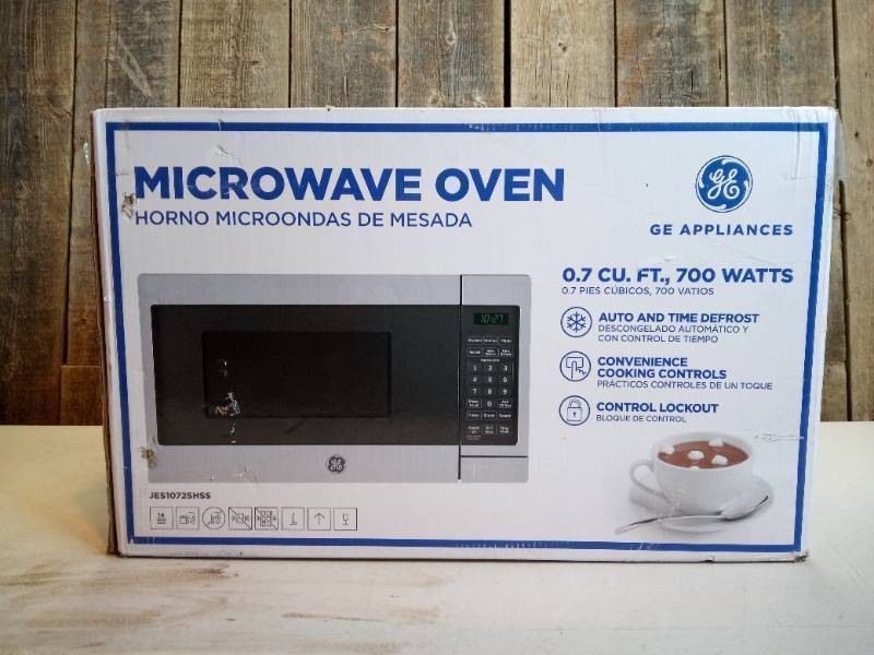 lot 30 image: GE - 0.7 Cu. Ft. Compact Microwave - Stainless steel