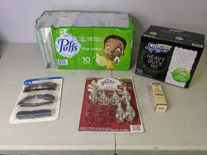 lot 63 image: New Puffs Plus Lotion Tissues, Sunglass Readers, Glade Plugin Refill, All Terrain Bite & Sting Soother, Swiffer Dry Heavy Duty