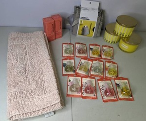 lot 148 image: New Mixed Lot (12) Scented Oil Refills, (3) Opalhouse Hero Candles, Room Essentials Backpack Laundry Bag, (2) Cocokind Facial Toner, & Threshold Reversible Performance Bath Rug