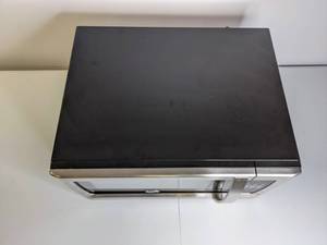 lot 261 image: New Oster 1.3 cu ft Countertop Microwave Oven