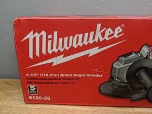 lot 15 image: Brand New Milwaukee 7 Amp Corded 4-12 in. Small Angle Grinder with Sliding Lock-On Switch