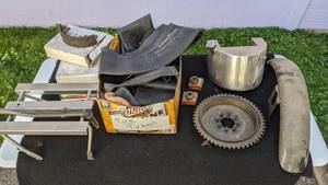 lot 38 image: Lot of Motorcycle Parts and Accessories Intertubes, Brake Shoes, Etc.