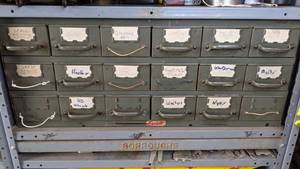 lot 52 image: 18-Drawer Metal Workshop Cabinet and Contents - Discs, Nuts & Bolts, Sheet Metal Clamps, Harley-Davidson, Washers, Springs, Screws, Glasses, and more