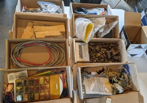 lot 114 image: Mixed Outdoor Supplies Lot Garage Door Hardware, Shims, Braided metal housing, & More