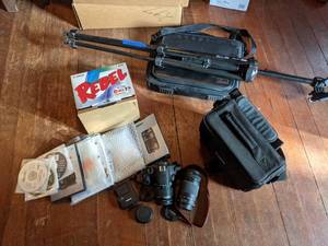 lot 229 image: Canon EOS Rebel T5 Camera, Targus Computer Bag, and Focal Tripod