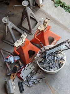 lot 104 image: Set of (2) Pairs of Jack Stands & Misc. Hinges, Nails, & More