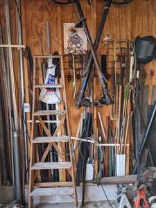 lot 100 image: Large Mixed Lot of Shop Supplies Chains, Welding Helmet, Wooden Ladder, Jack Stands, & More