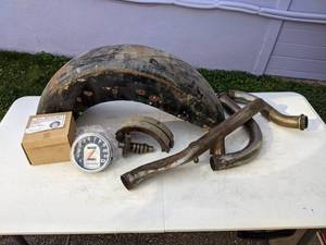 lot 57 image: Motorcycle Parts Speedometer, Fender, Pipes