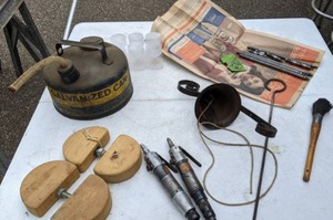 lot 138 image: Miscellaneous Vintage Garage Lot - Dinner Bell, Gas Can, Buckeye Air Tools, Harley-Davidson Seat Rods