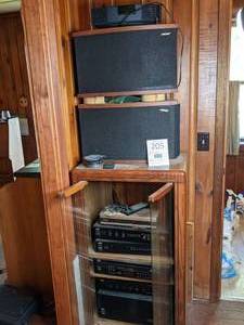 lot 205 image: Adcom and Bose Sound Systems in a Cabinet