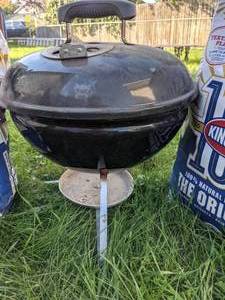 lot 210 image: Small Weber Charcoal Grill and Two Bags of Kingsford Charcoal