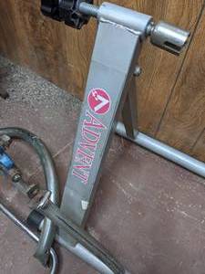 lot 270 image: Advent Stationary Bike Stand and Bicycle Parts