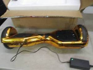 Gold Hover board, powers on, charge...