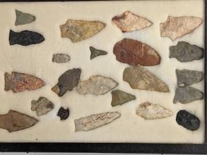 lot 138 image: Collection of Native American Arrowheads in a Display