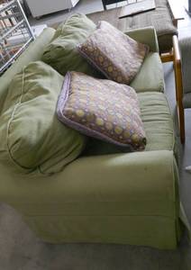 lot 50 image: Green loveseat and pillows 59wide and 33 deep