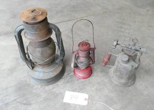 lot 84 image: a Dietz lantern, a small west germany lantern and a brass torch
