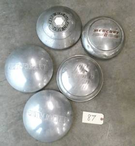 lot 87 image: Group of 5 collectible wheel covers - Ford, Chevrolet, Mercury, Packard