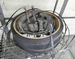 lot 103 image: big roll of plastic banding with tools and clips