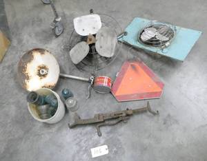 lot 106 image: Cleveland Model T tire changing tool, a couple of old barn fans, light fixture, pail of insulators, slow moving sign