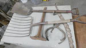lot 125 image: Group of misc, shovel, hay fork, ice tongs, shoe iron, saw