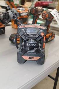 lot 412 image: Ridgid R84084 18V Cordless AMFMMP3 Radio Player  Charger  with Battery